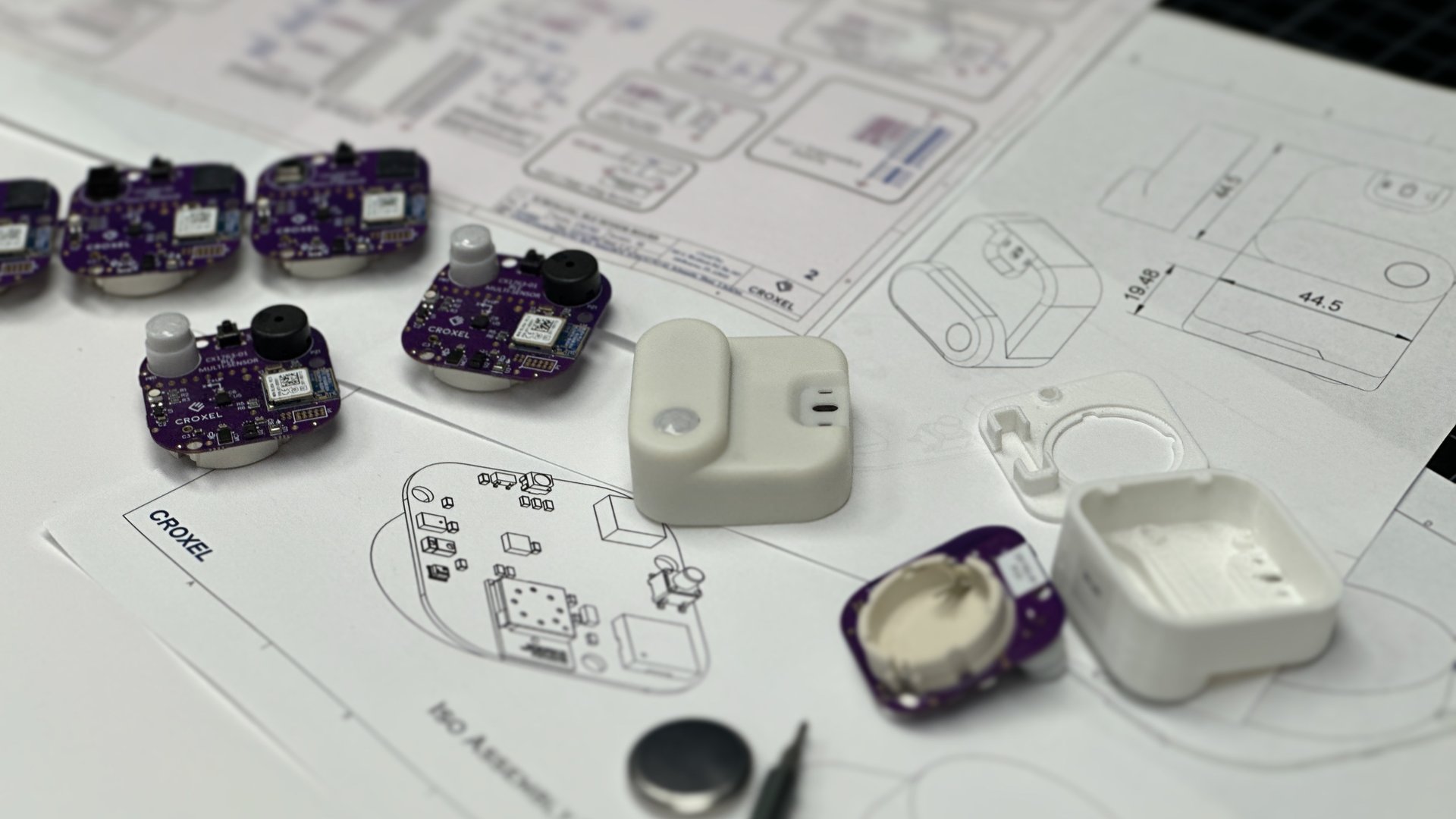Product development team collaborating on IoT hardware design